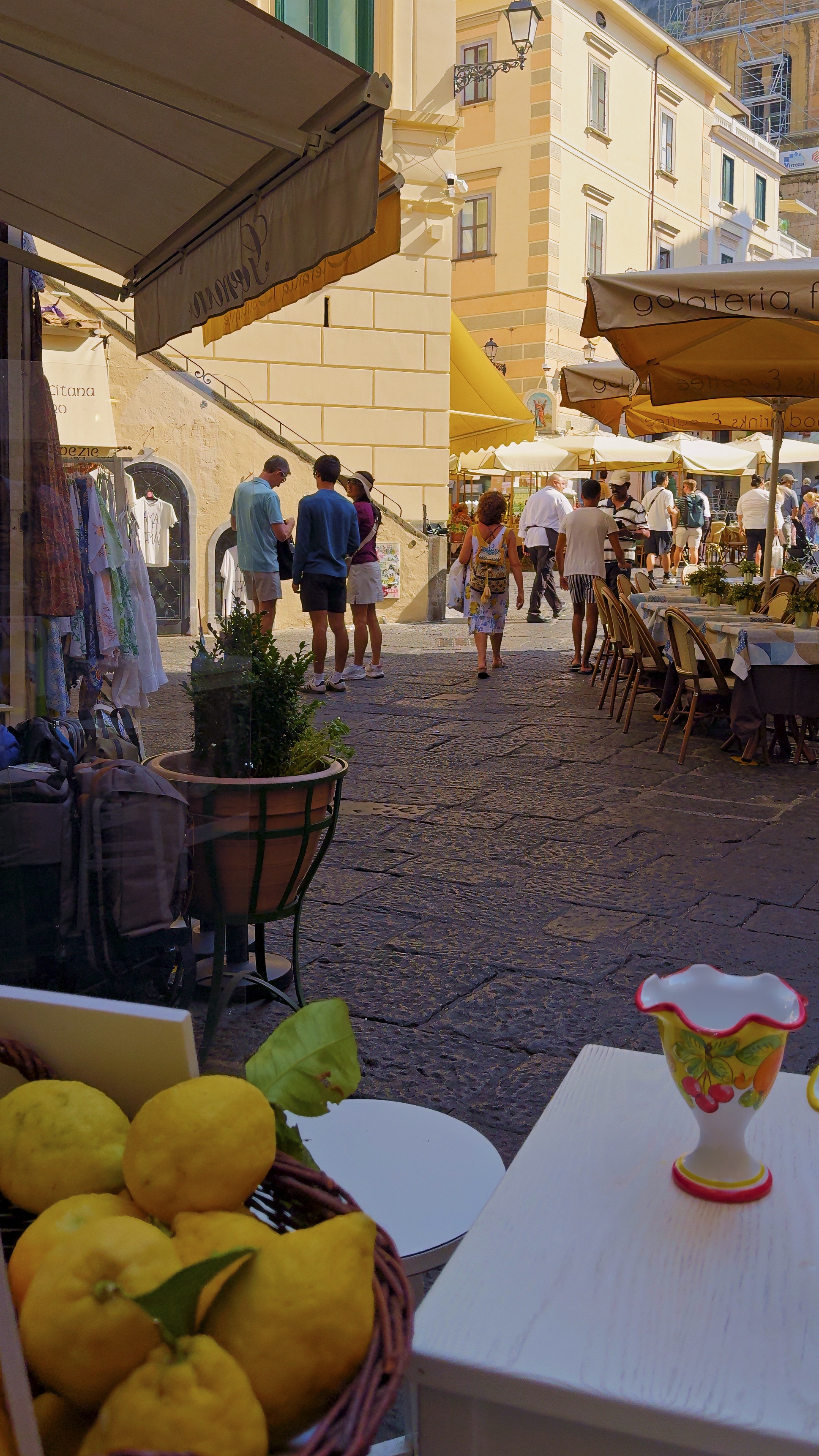 A basket of Amalfi lemons at a café table in the town's main street.
