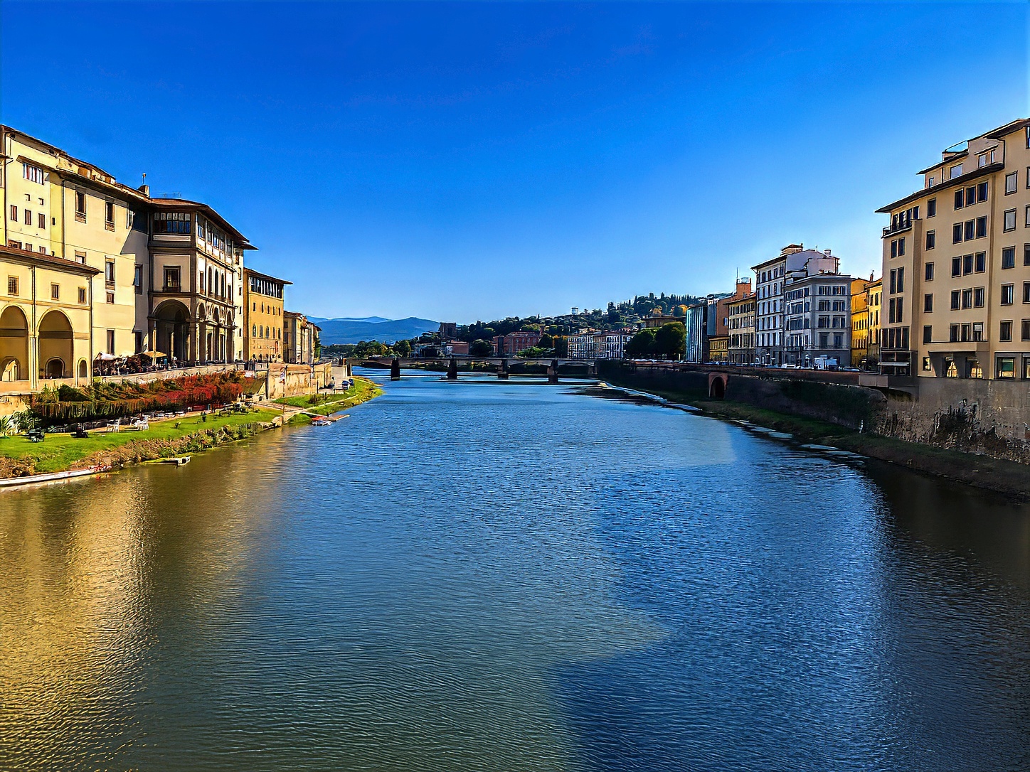 The Arno running between the palazzi of the Lungarni, seen from one of Florence's bridges.