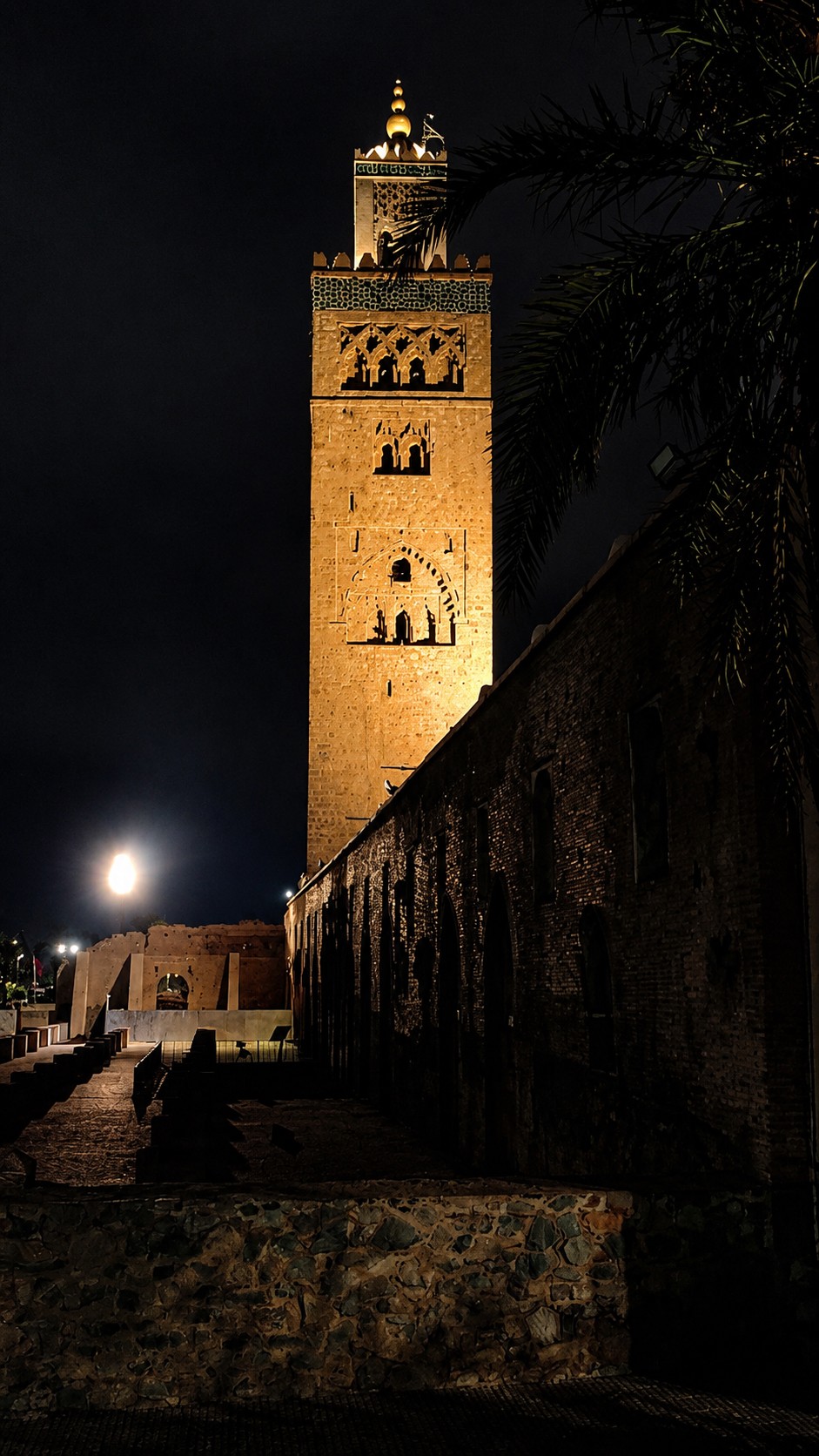 The Koutoubia minaret lit up against the night sky.